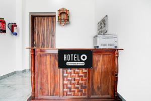 a hotel entrance with a sign in front of a door at Super Hotel O Mehta College And Institute Of Technology Formerly Lara Heritage in Jaipur