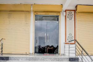 an open door of a building with a window at Super Hotel O Mehta College And Institute Of Technology Formerly Lara Heritage in Jaipur +23 photos