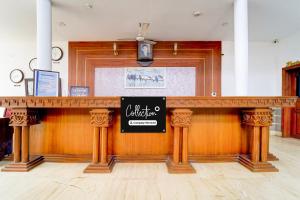 a bar in a restaurant with a sign on it at Super Collection O Kangarappady Formerly Cochin Residency in Kakkanad