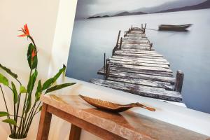 a painting of a pier on a wall at 4A Wood St-PetsNegotiable Linen Included Wi-Fi - Linen Included in Kilki