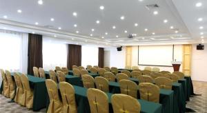 a conference room with chairs and a podium in it at City Comfort Inn Nanning Wuyi Fude in Nanning