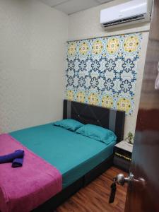 a room with two beds and a window and a door at CZ HOTEL in Pasir Puteh +4 photos