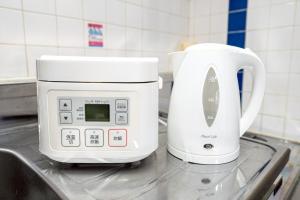 Kuchyň nebo kuchyňský kout v ubytování メトロ春日203