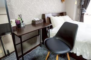 Postel nebo postele na pokoji v ubytování メトロ春日203