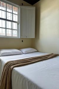 Ένα ή περισσότερα κρεβάτια σε δωμάτιο στο Bela Vista Home