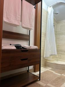 a bathroom with a wooden cabinet with a shower at Taverna La Torre in Bassano del Grappa +44 photos