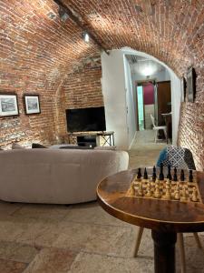 a living room with a brick wall at Taverna La Torre in Bassano del Grappa