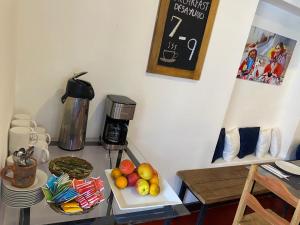 a table with a tray of fruit on it at Runa House in Cusco