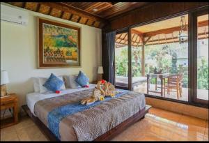 Ένα ή περισσότερα κρεβάτια σε δωμάτιο στο Abangan Bungalow +67 φωτογραφίες