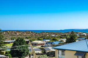 a view of a town with houses and the ocean at SEASCAPE - Pet Friendly Linen Included - 65 Corcoran in Goolwa South