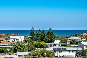 a view of a city with houses and the ocean at SEASCAPE - Pet Friendly Linen Included - 65 Corcoran in Goolwa South