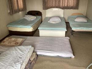 Postel nebo postele na pokoji v ubytování Ichihara city house - Vacation STAY 19999 + 9 fotografií