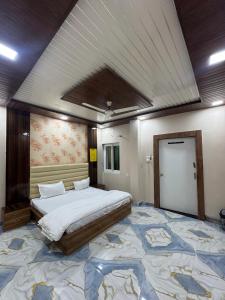 a bedroom with a large bed and a large rug at Baghdad Palace Near Dargah sharif in Ajmer +24 photos