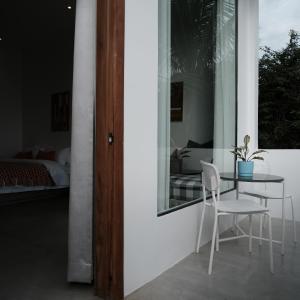 a room with a table and two chairs and a bed at Serenity Angkor in Phum Pobos +58 photos