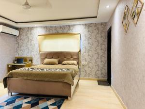 Ένα ή περισσότερα κρεβάτια σε δωμάτιο στο Disha Farm +21 φωτογραφίες