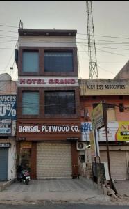 a building with a motorcycle parked in front of it at hotel grand in Zirakpur