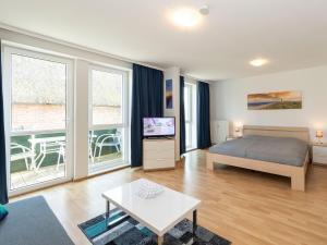 Ένα ή περισσότερα κρεβάτια σε δωμάτιο στο Höftresidenz Alt Reddevitz - Wohnung 14