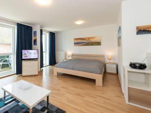 Ένα ή περισσότερα κρεβάτια σε δωμάτιο στο Höftresidenz Alt Reddevitz - Wohnung 14