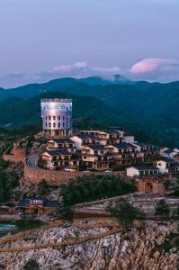 an aerial view of a building on a mountain at Zhangjiajie Valley Secret Resort in Zhangjiajie