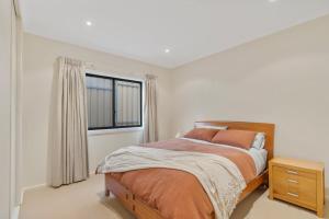 a bedroom with a bed and a window at Bluffview B&B - Luxury Oceanviews - Wi-Fi - No Linen Included in McCracken