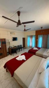 Ένα ή περισσότερα κρεβάτια σε δωμάτιο στο Moonlight Residency