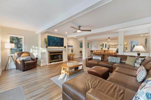 a living room with a couch and a fireplace at MG3080: 3080 Marshgate in Seabrook Island