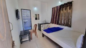 Ένα ή περισσότερα κρεβάτια σε δωμάτιο στο Sachi home stay