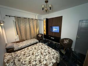 Ένα ή περισσότερα κρεβάτια σε δωμάτιο στο The HQ