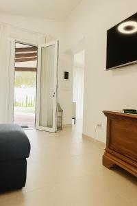 a living room with a couch and a sliding glass door at VILLA MAR in Cala'n Bosch