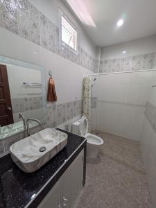 a bathroom with a sink and a toilet at Samakki Residence - Modern Rooms, Quiet Area, Near the Beach in Rawai Beach +42 photos