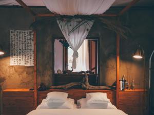 Postel nebo postele na pokoji v ubytování La Terra Resort