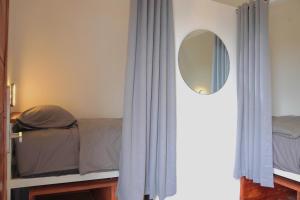a bedroom with a bed and a mirror at Tipsea Turtle Gili Trawangan in Gili Trawangan +22 photos