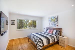 Ένα ή περισσότερα κρεβάτια σε δωμάτιο στο Harbour Haven - steps from Ulladulla Harbour