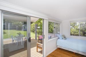 Ένα ή περισσότερα κρεβάτια σε δωμάτιο στο Harbour Haven - steps from Ulladulla Harbour