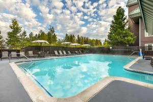 a large swimming pool with blue water at Hilton Vacation Club Lake Tahoe Resort South in South Lake Tahoe