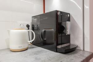 a microwave oven sitting on top of a counter at Gauja forest retreat in Gauja