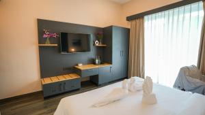 Postel nebo postele na pokoji v ubytování Surf and Sand