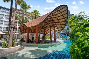 a pool at a resort with a pavilion at Wyndham Gardens 1321 Studio 1m from Naithon Beach in Nai Thon Beach