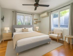 a bedroom with a bed and a ceiling fan at Patricks Road Ferny Hills in Ferny Hills
