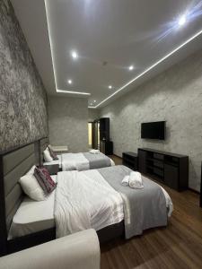 Postel nebo postele na pokoji v ubytování Vatan Hotel