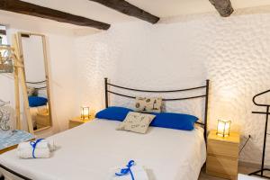 Postel nebo postele na pokoji v ubytování La Scogliera