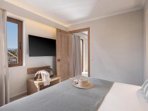 Ένα ή περισσότερα κρεβάτια σε δωμάτιο στο Okeanis Golden Resort +77 φωτογραφίες