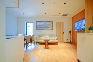 a living room with a couch and a table at Nakano World Hotel in Tokyo