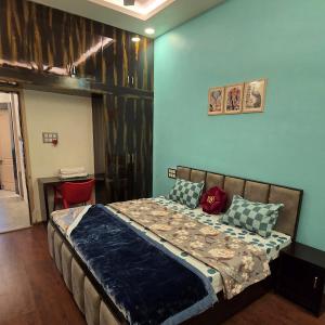 a bedroom with a bed in a room at Aditi Premium Homestay GF in Jabalpur