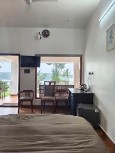 Postel nebo postele na pokoji v ubytování Royce Resort