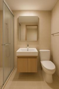 a bathroom with a toilet and a sink and a shower at Busan Seomyeon Nestly Hotel in Busan