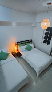 Postel nebo postele na pokoji v ubytování Awesome Stay in Baguio + 11 fotografií