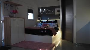 a small bedroom with a bed in a room at Apartment Sova or Deluxe room 33 in Bled