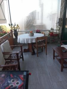 a room with a table and chairs on a patio at Oasi di pace in Rocca deʼGiorgi