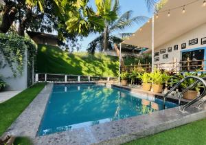 a swimming pool in the backyard of a house at The Plix Villa, Vagator in Anjuna +23 photos